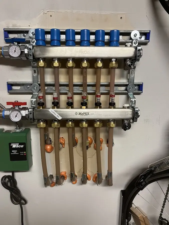 Plumber performing Gas Line Installation at a residential property in Mendon